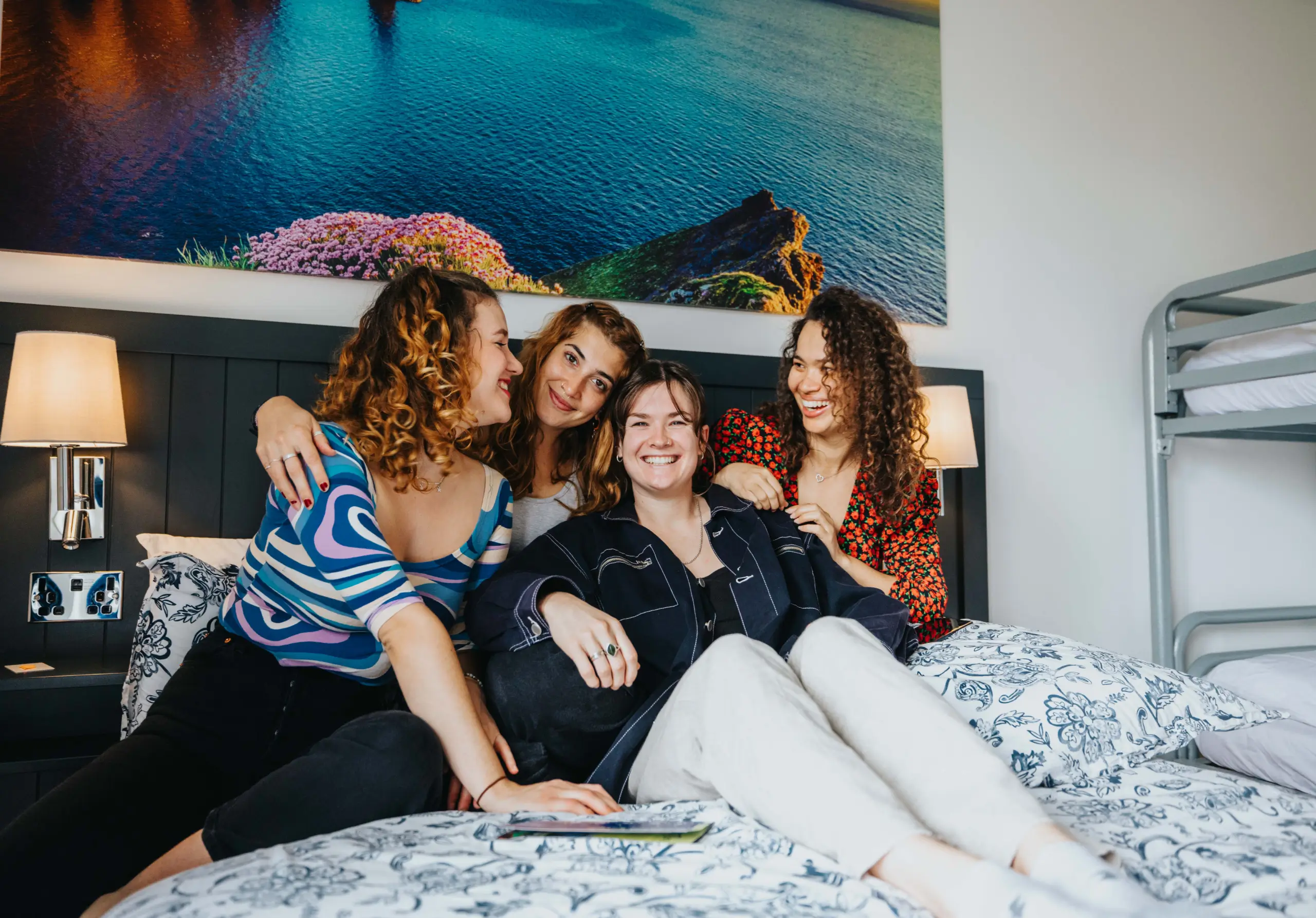 Friends relaxing together in a private hostel room