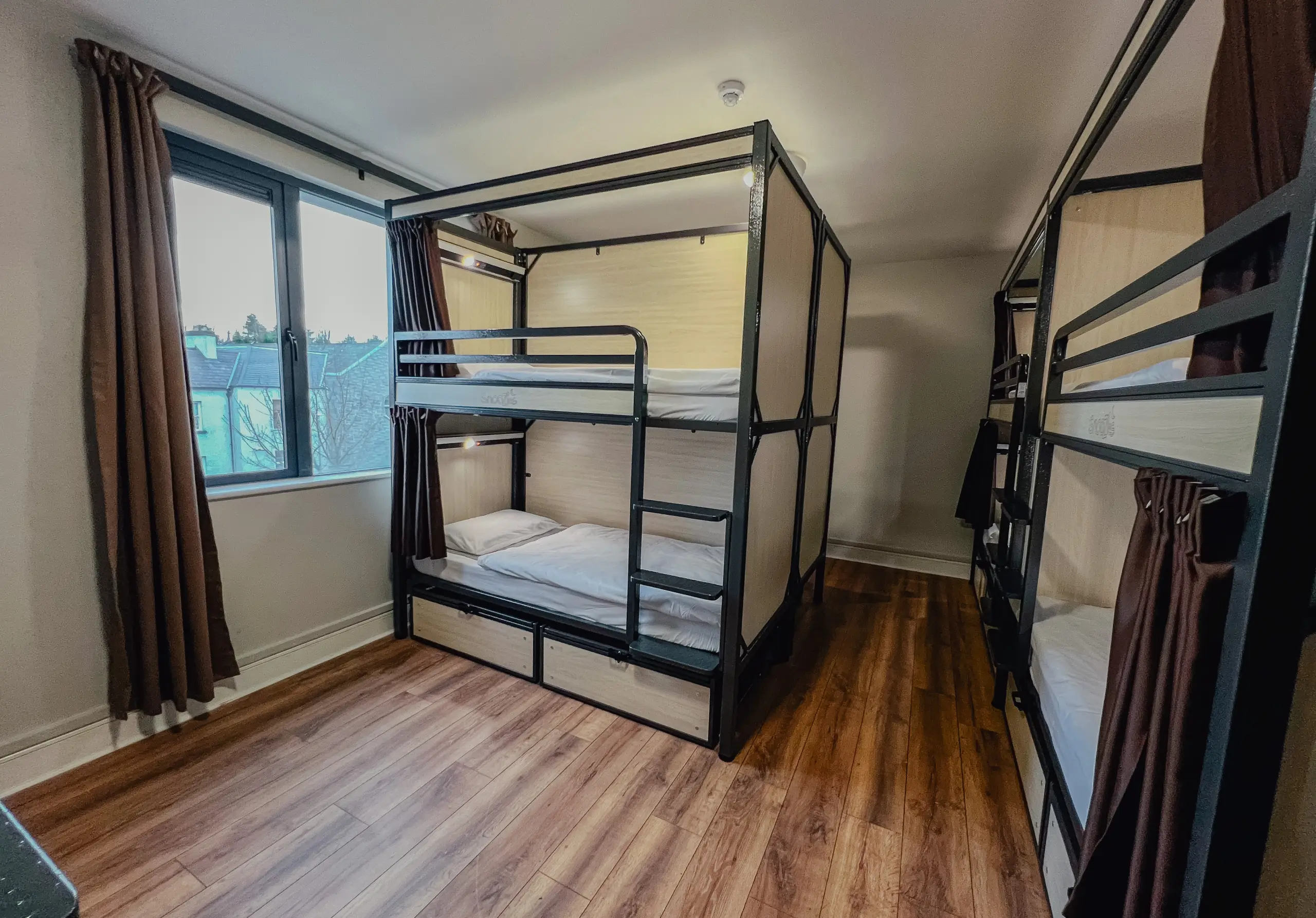 Clean and spacious dormitory room with bunk beds